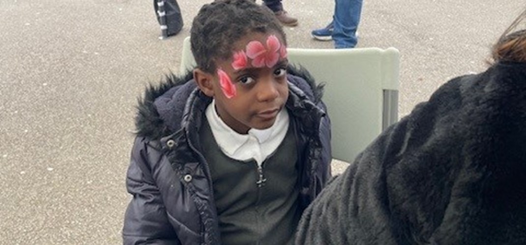 Child getting their face painted